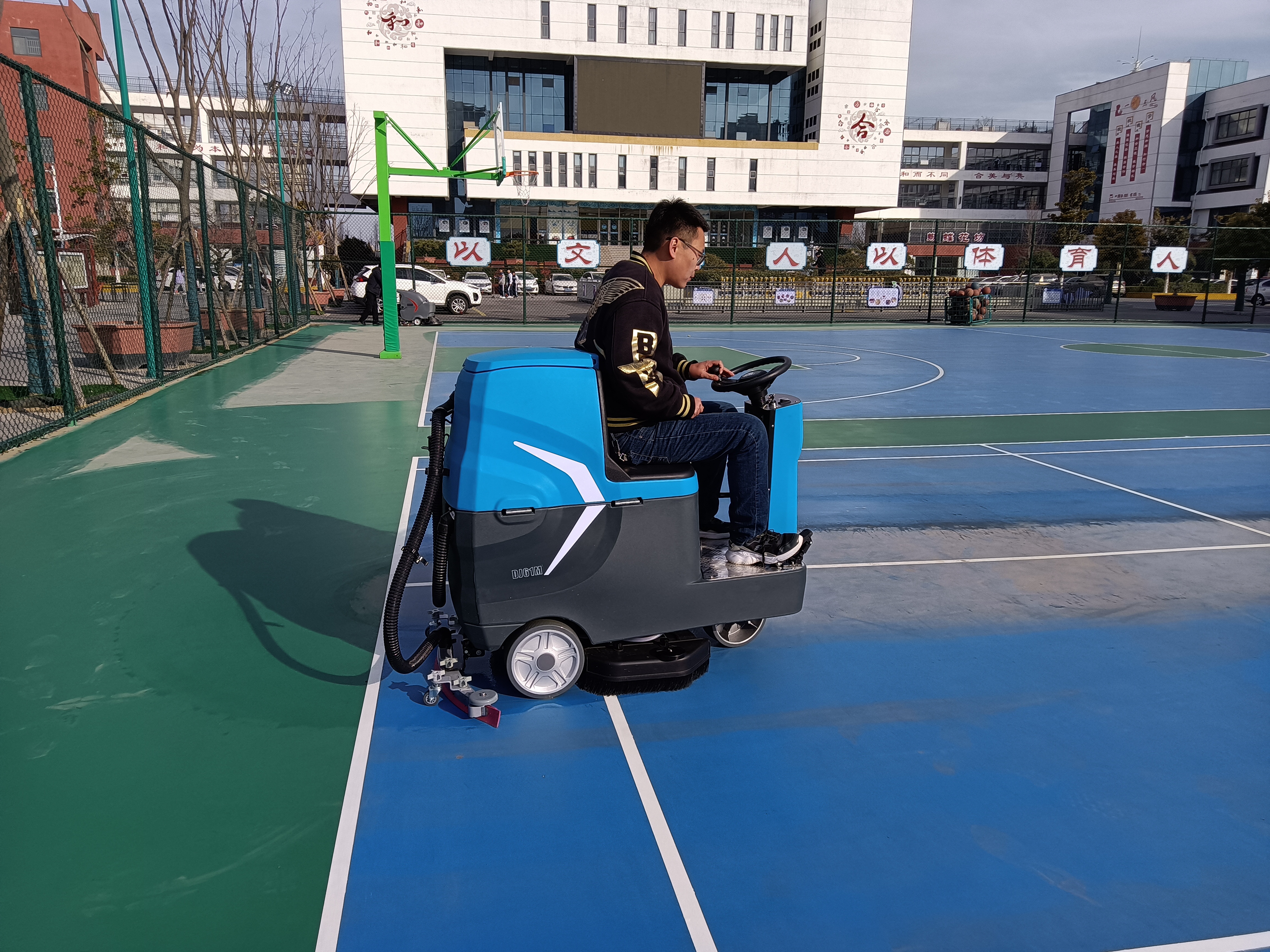 What cleaning problems have industrial floor scrubbers helped factories solve?