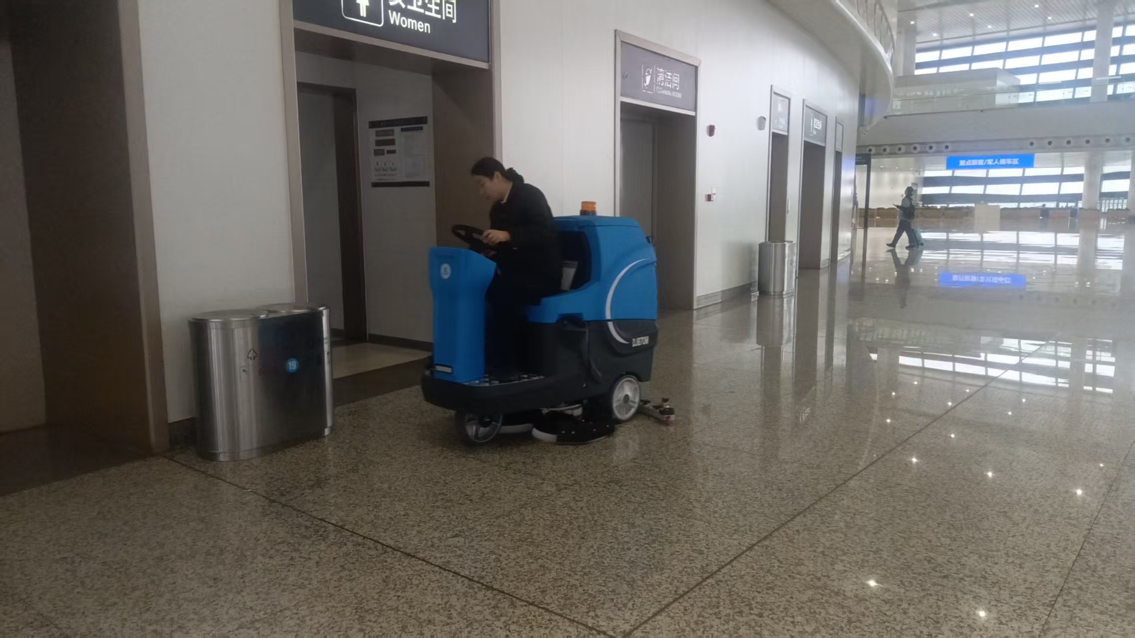 Why are industrial floor scrubbers suitable for station concourses?